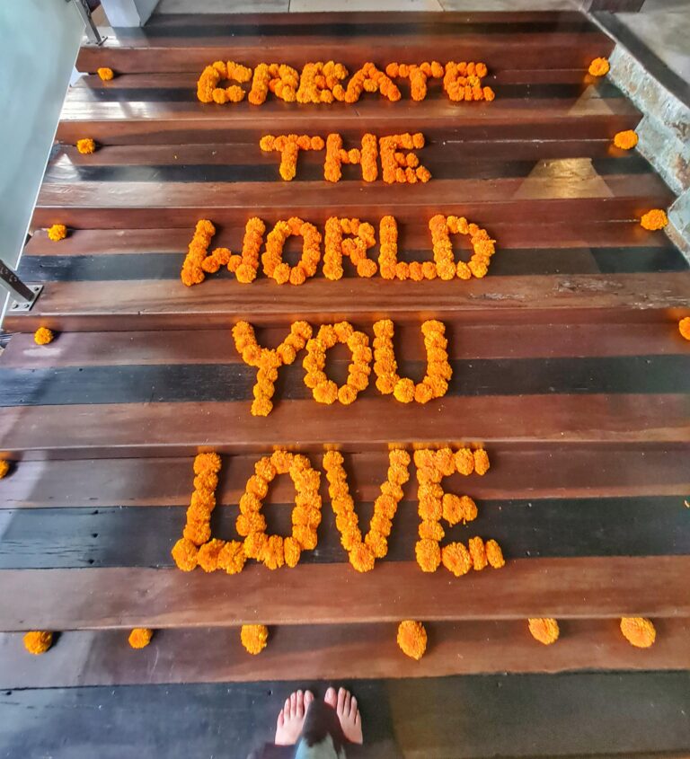 Flowers arranged on stairs at Clear cafe forming the beautiful message