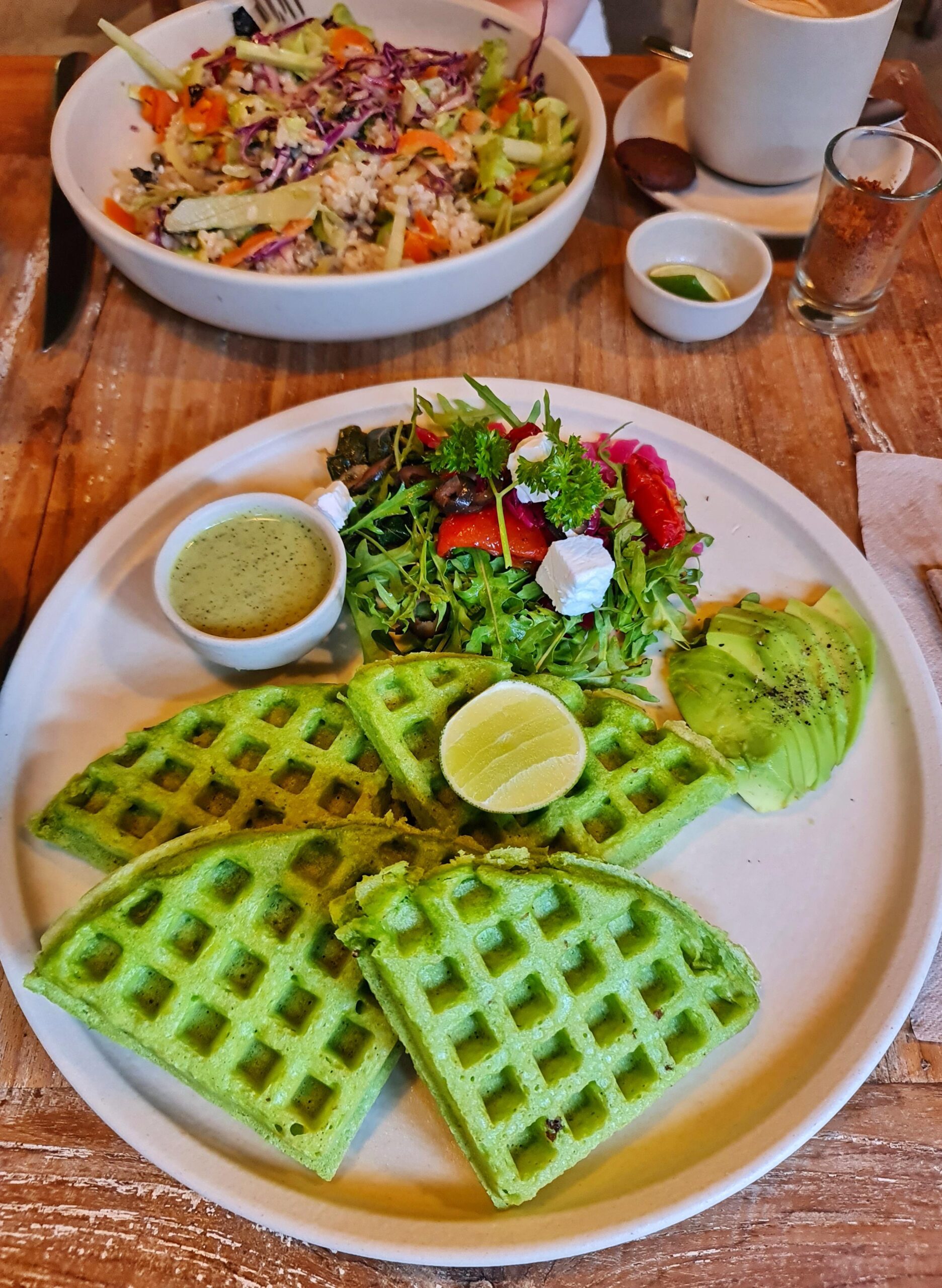 Vibrant green vegan waffles served at Alchemy Ubud