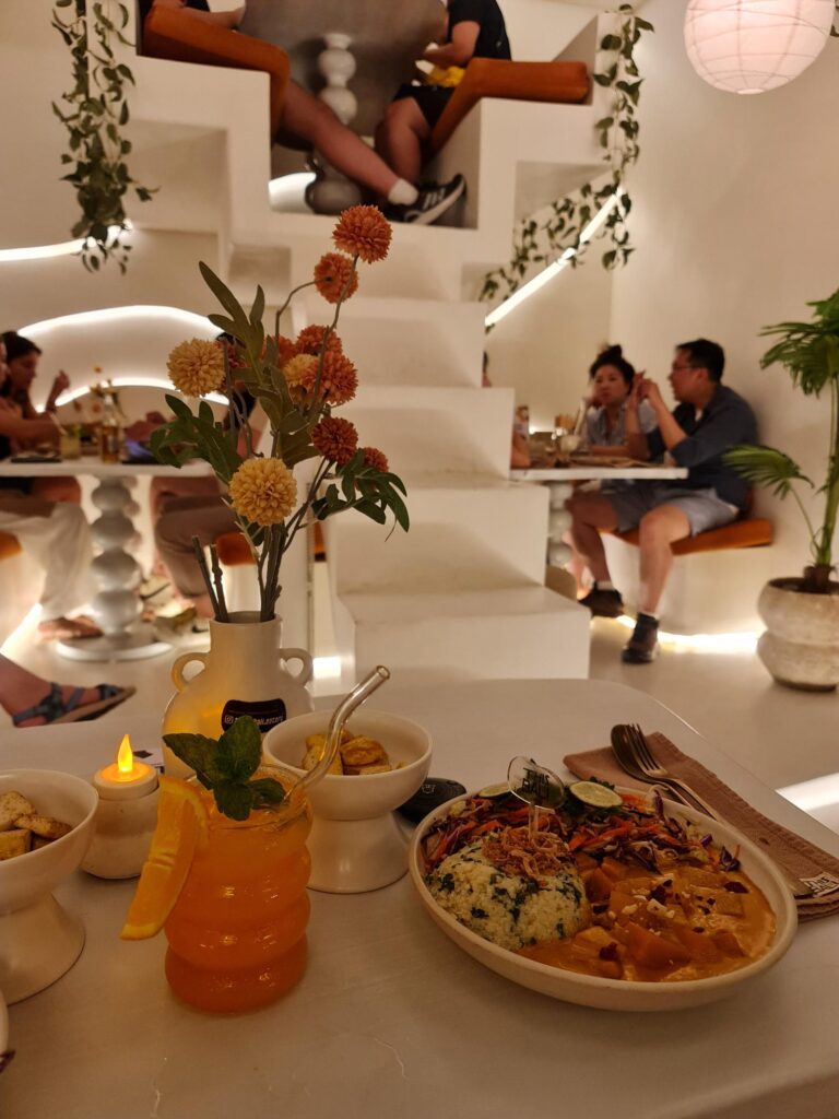 Minimalist all-white interior of This is Bali restaurant in Ubud.