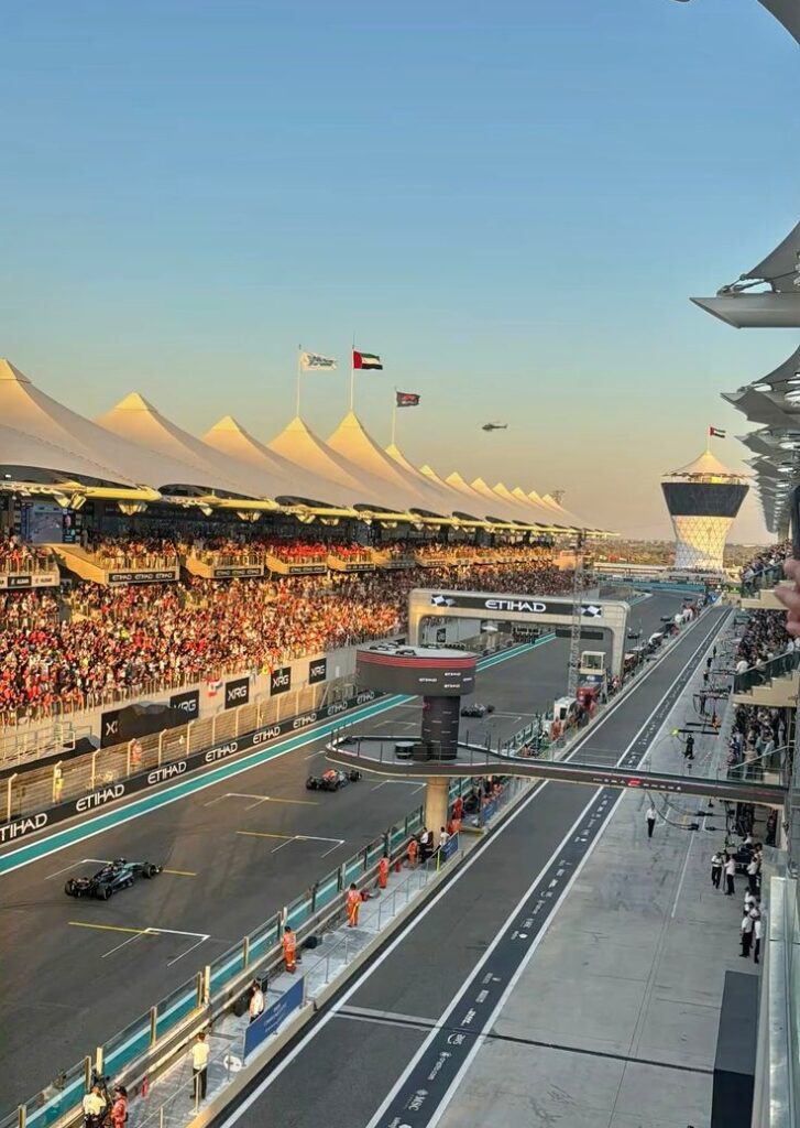 Fans waving flags and taking photos at Yas Marina Circuit during F1 in Abu Dhabi