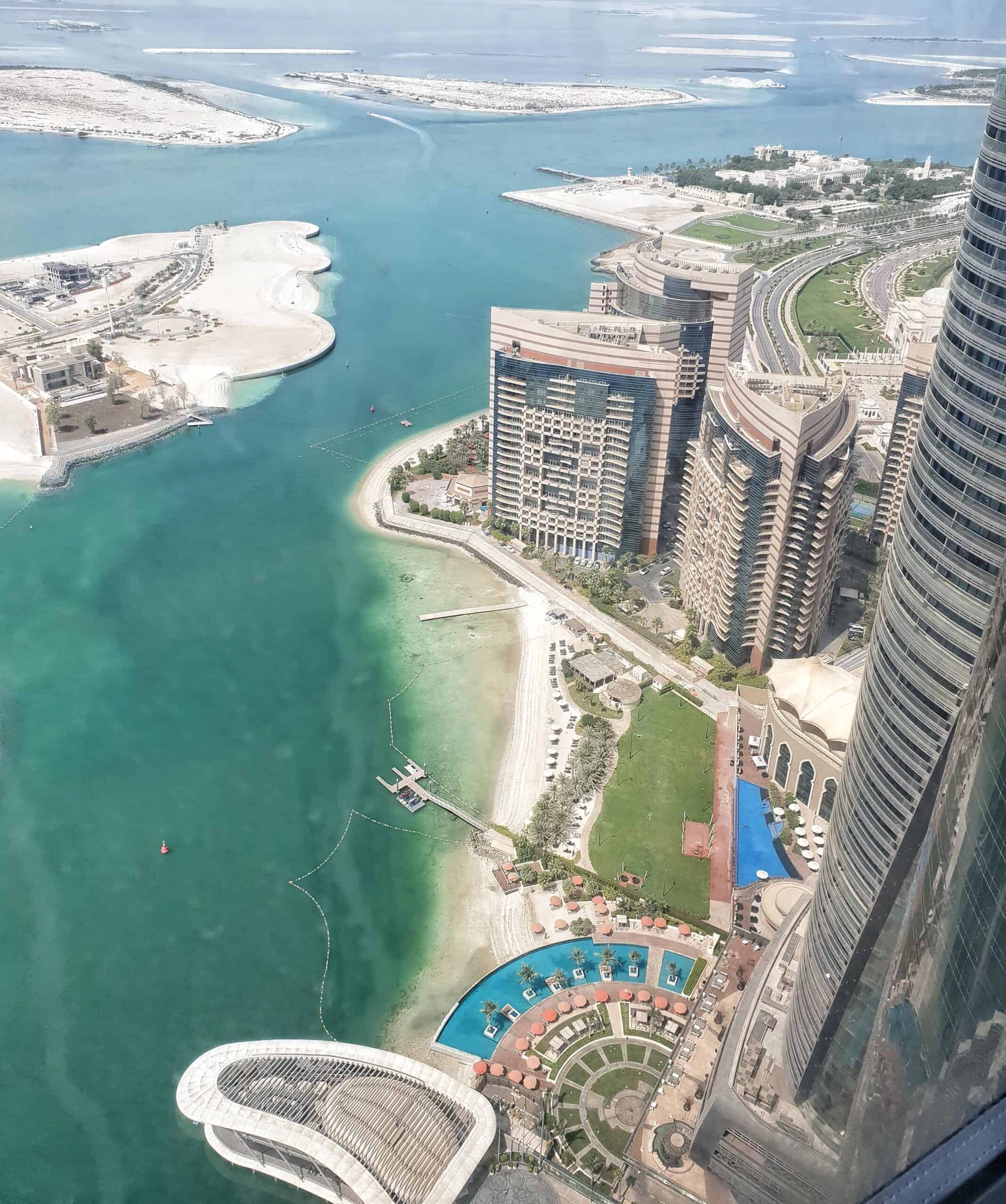 Abu Dhabi skyline with luxury hotels and waterfront views.