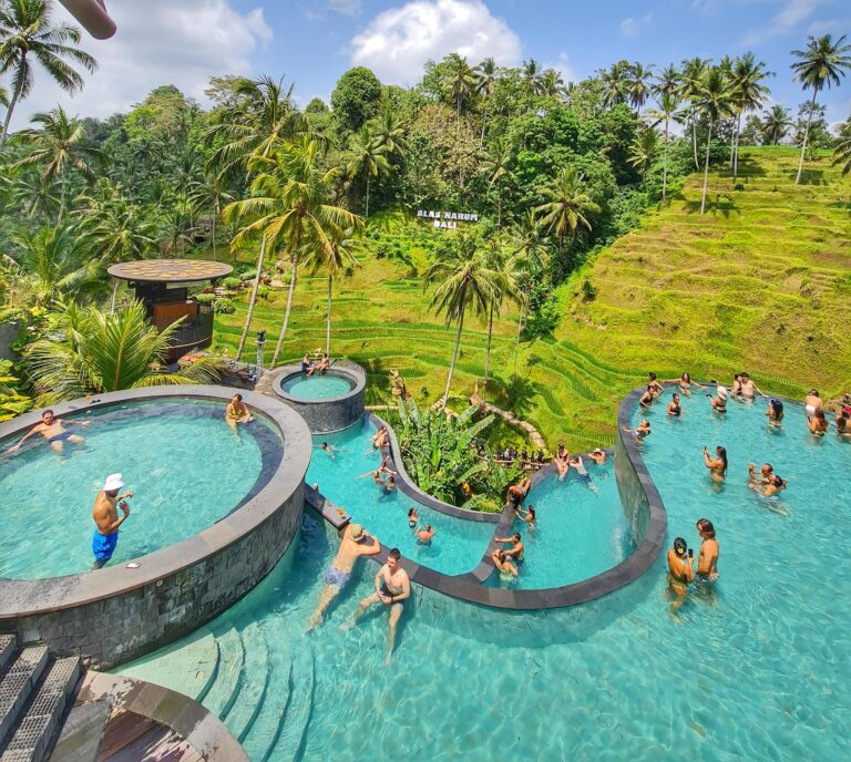 Swimming pool with a scenic view of rice terraces in the background on a sunny day