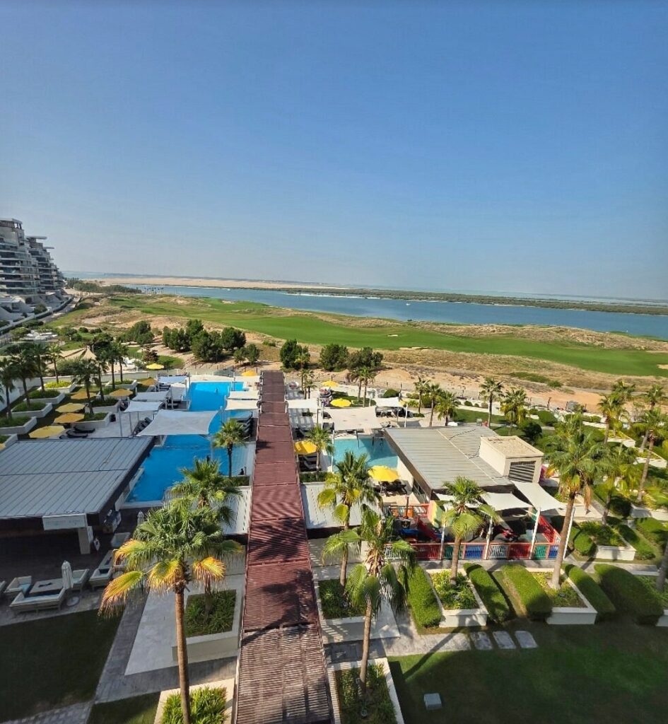 Sheikh Zayed Grand Mosque Hotel room balcony overlooking pool at Crowne Plaza Yas Island