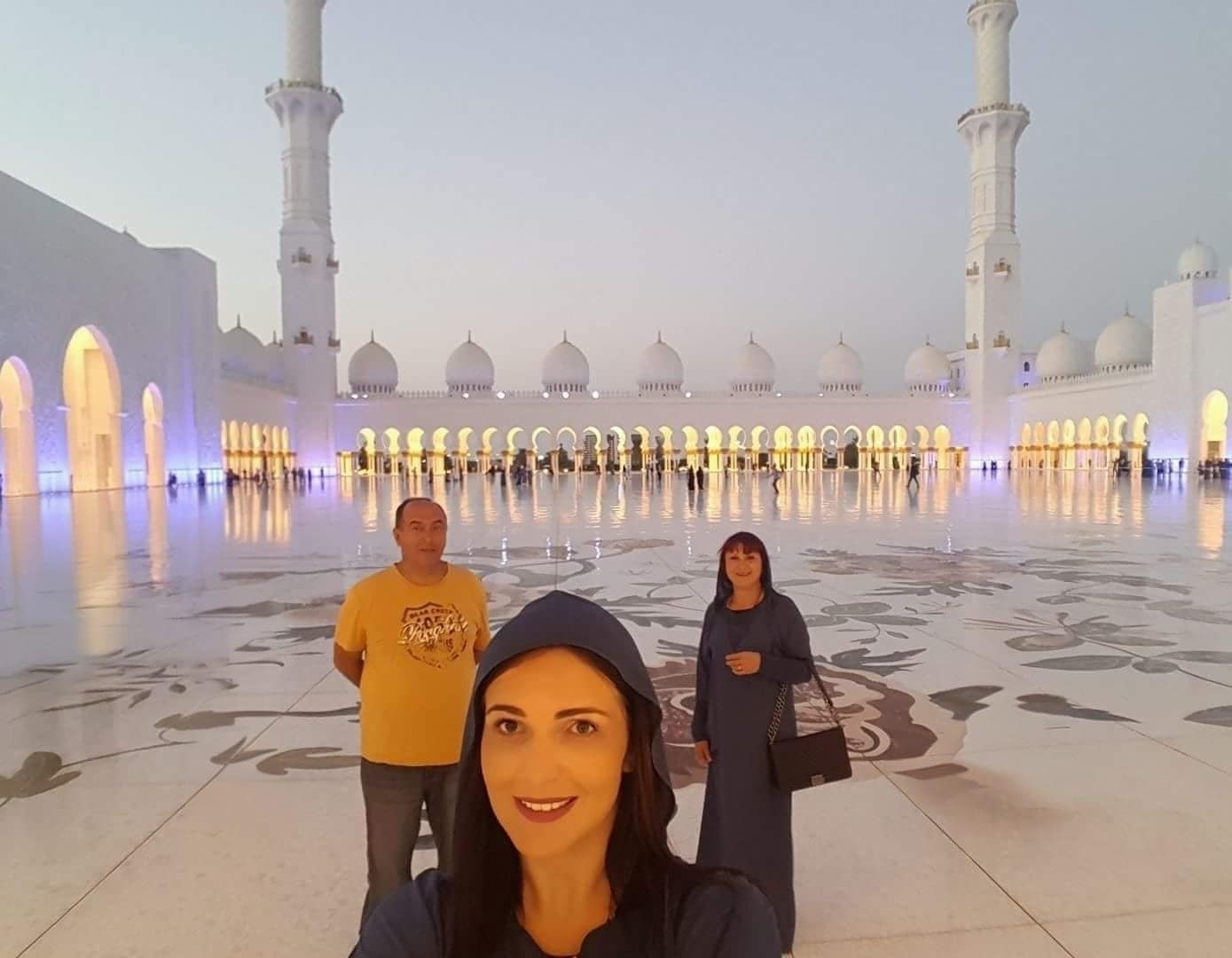 Beautiful woman taking selfie at Sheikh Zayed Mosque Abu Dhabi.