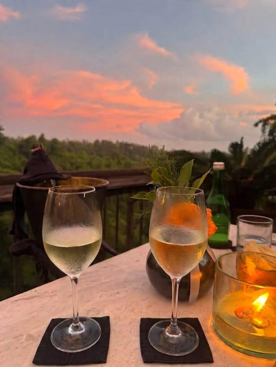 Evening romantic dinner with 2 glasses of white vine with amazing view