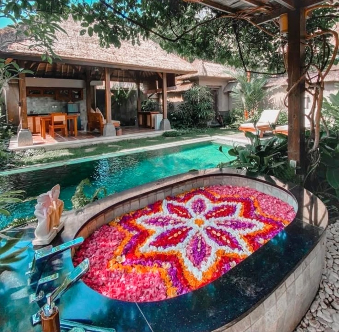 Flower bath with floating petals in a Bali spa setting