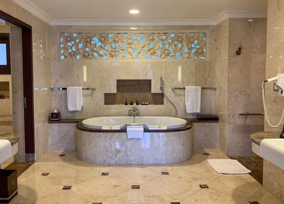 Modern hotel bathroom in Bali with a jacuzzi bathtub and stylish interior design