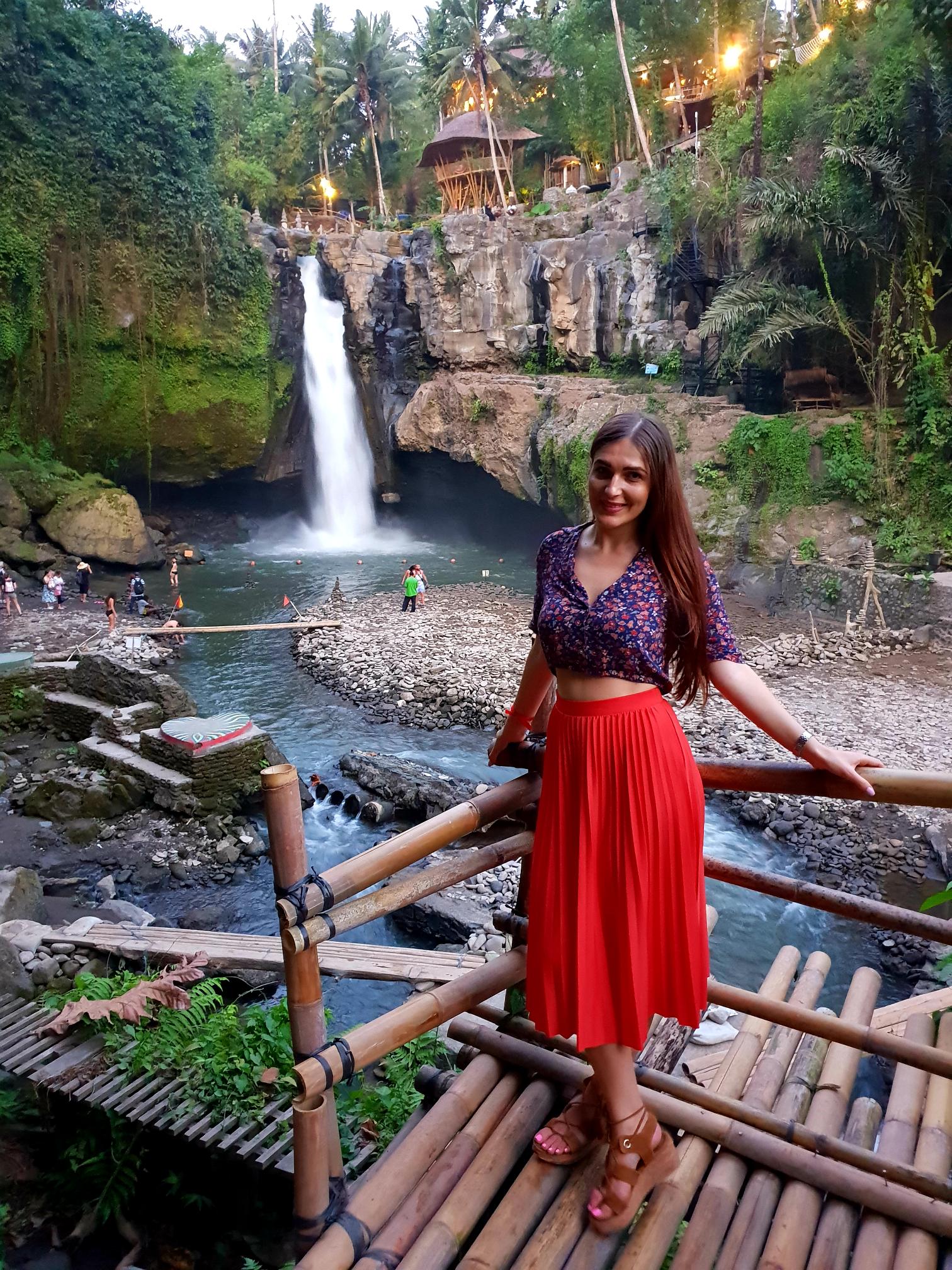 Tegenungan Waterfall in Bali surrounded by tropical greenery and flowing water