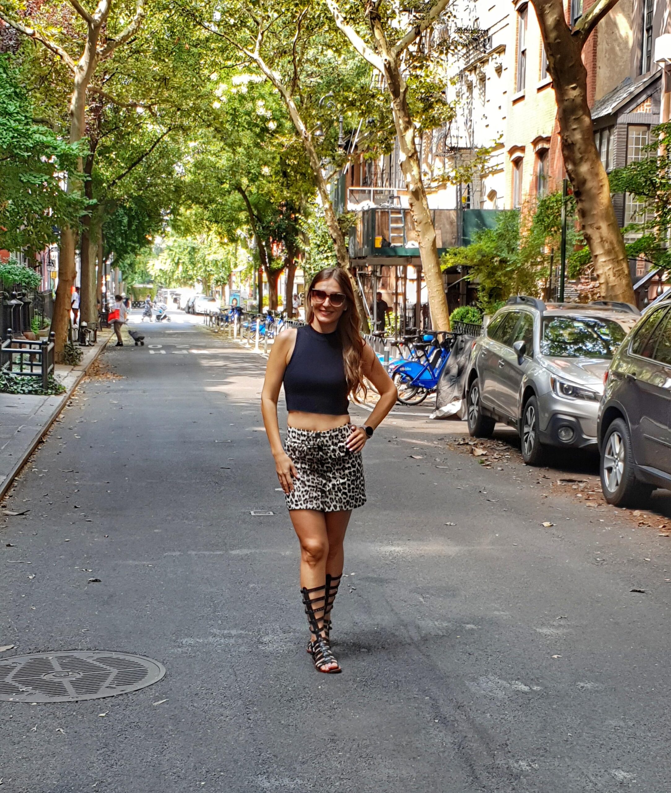 Woman walking in West Village street New York City