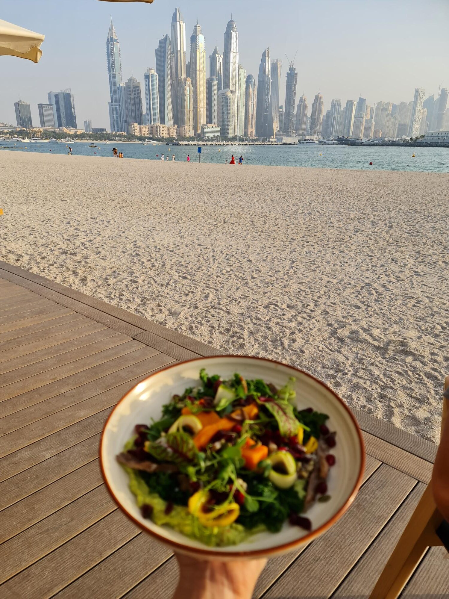 Dubai Marina skyline view from restaurant terrace with waterfront and modern skyscrapers