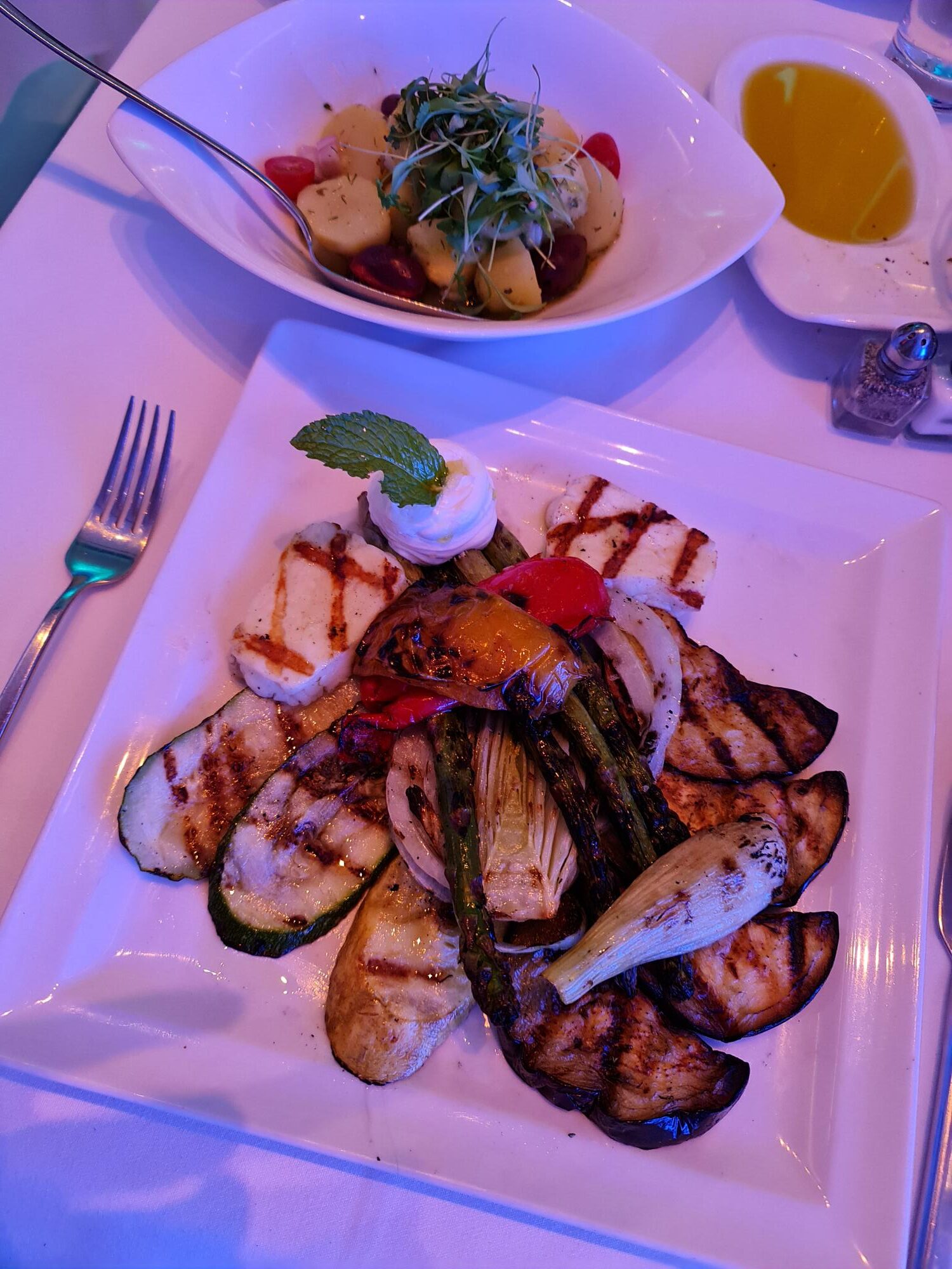 Plate of Mediterranean seafood dish served at Limani restaurant in New York.