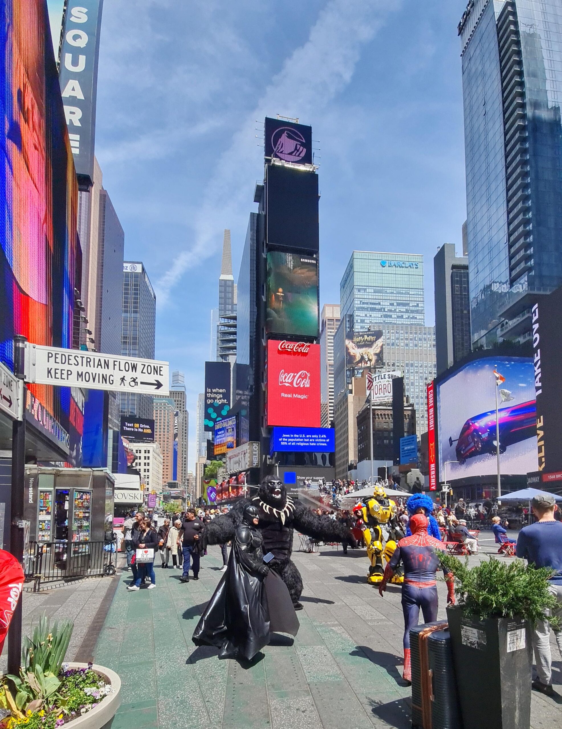 Busy Times Square street scene with billboards in NYC