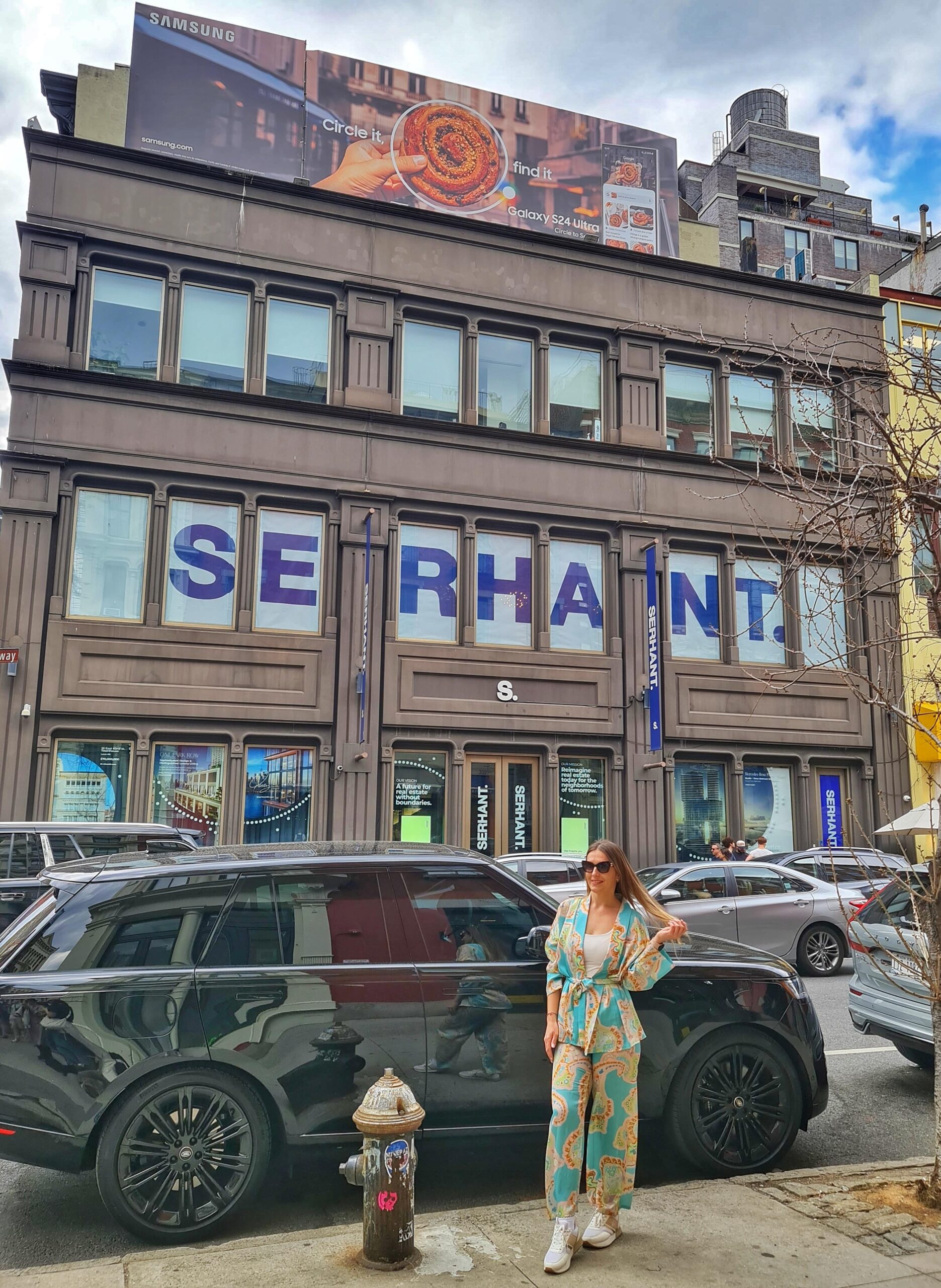 Woman standing in front of Serhant office SoHo New York City