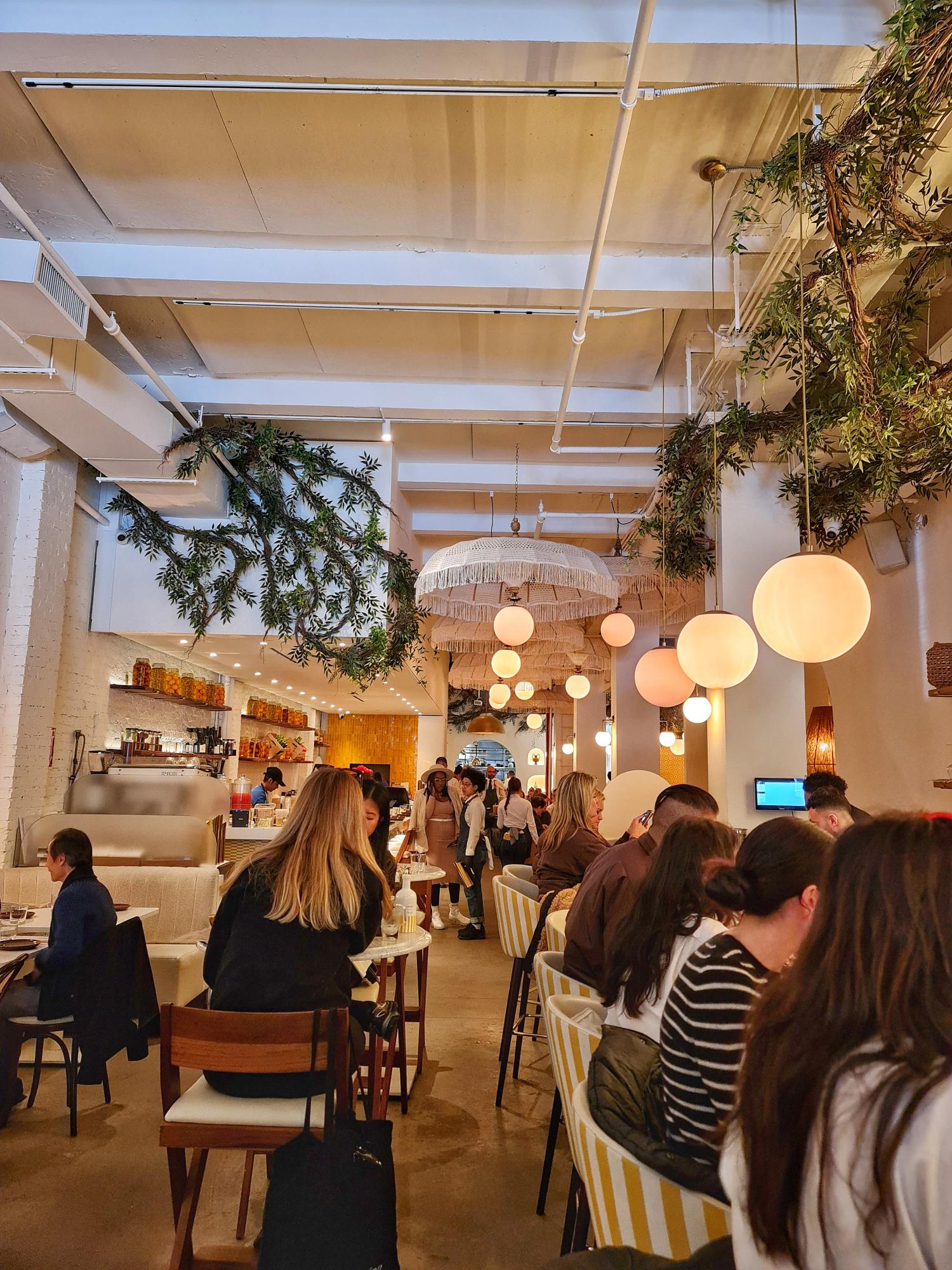 Interior of Motek Mediterranean restaurant with warm, modern design.