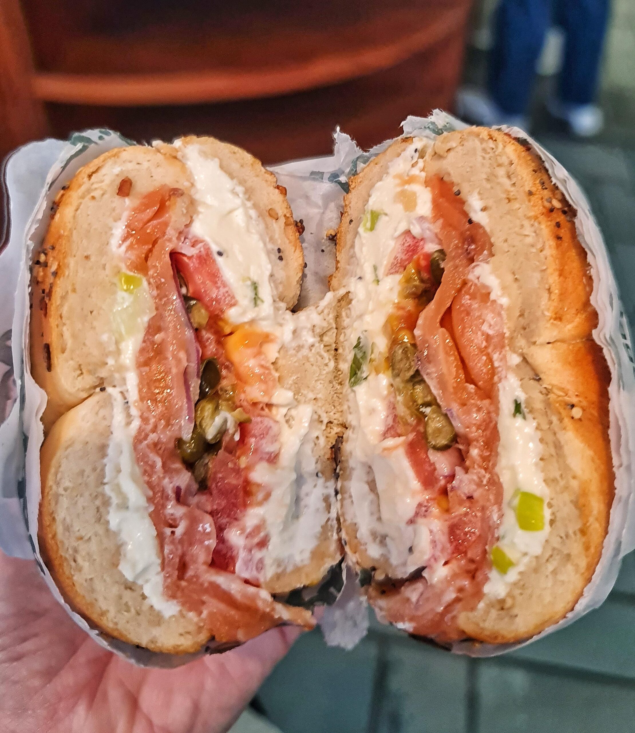 Fresh bagel sandwich with salmon and vegetables in New York City.