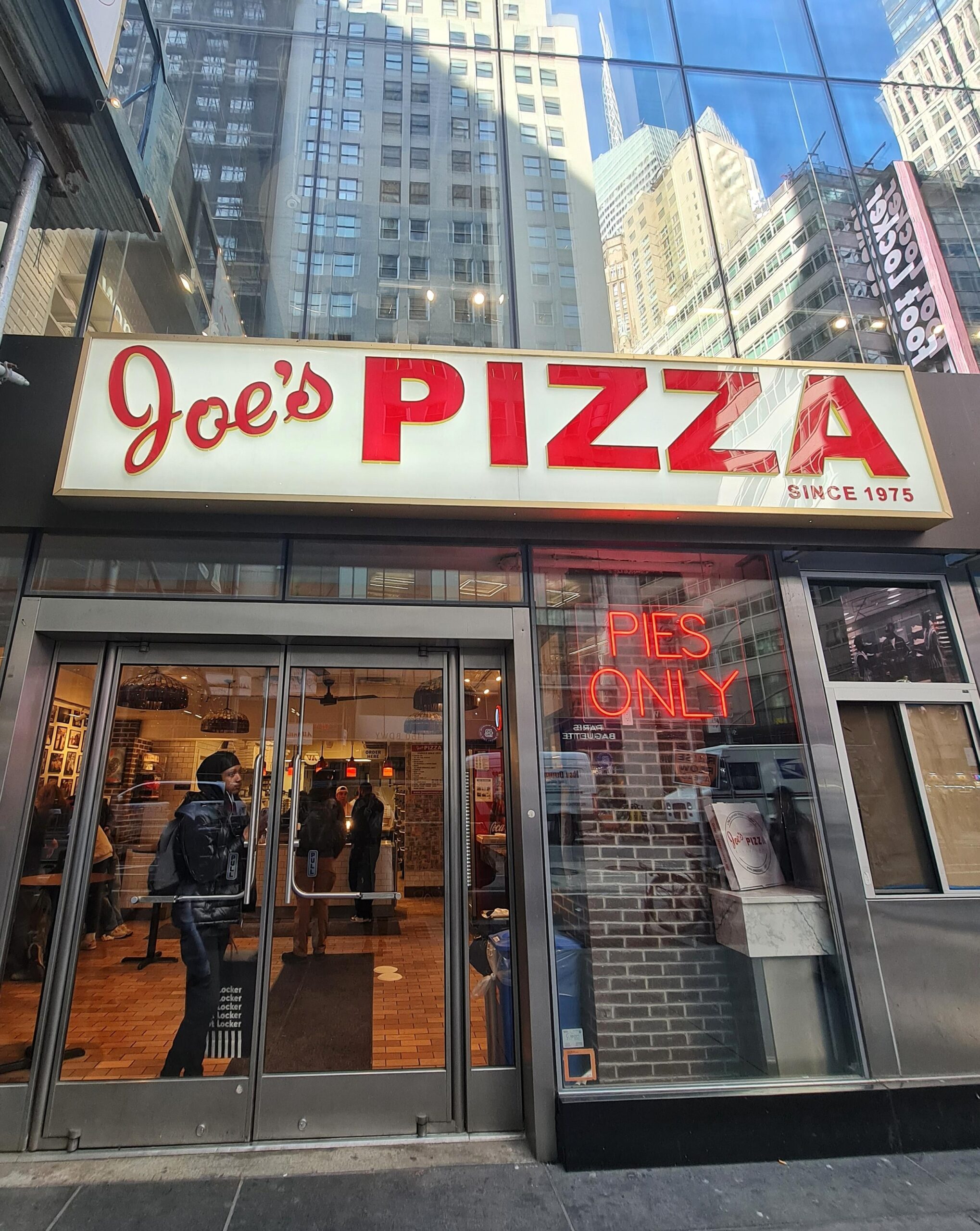Exterior of Joe’s Pizza, a famous pizza spot in New York City.
