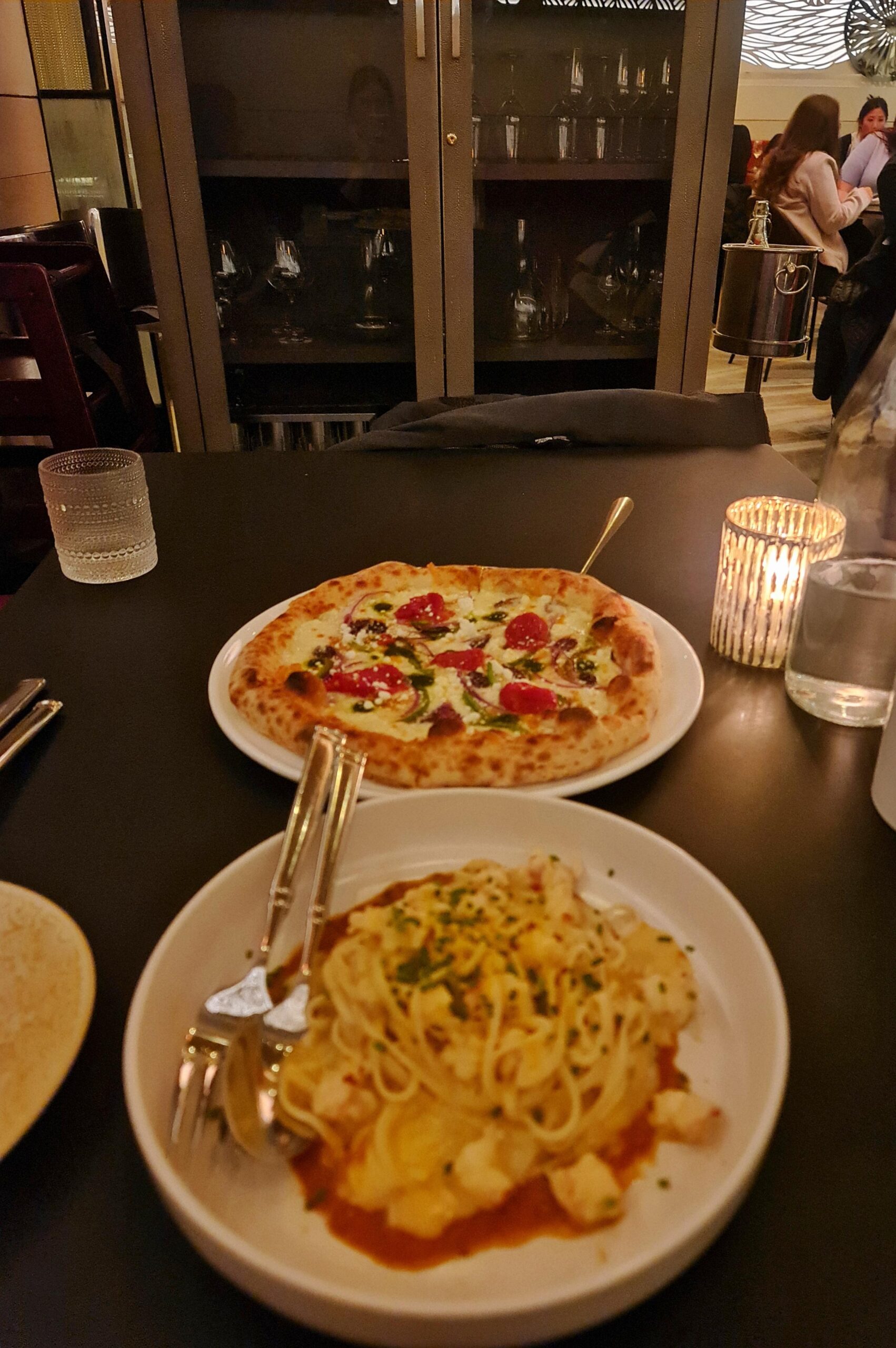 Italian pizza and pasta served in a cozy New York City restaurant.
