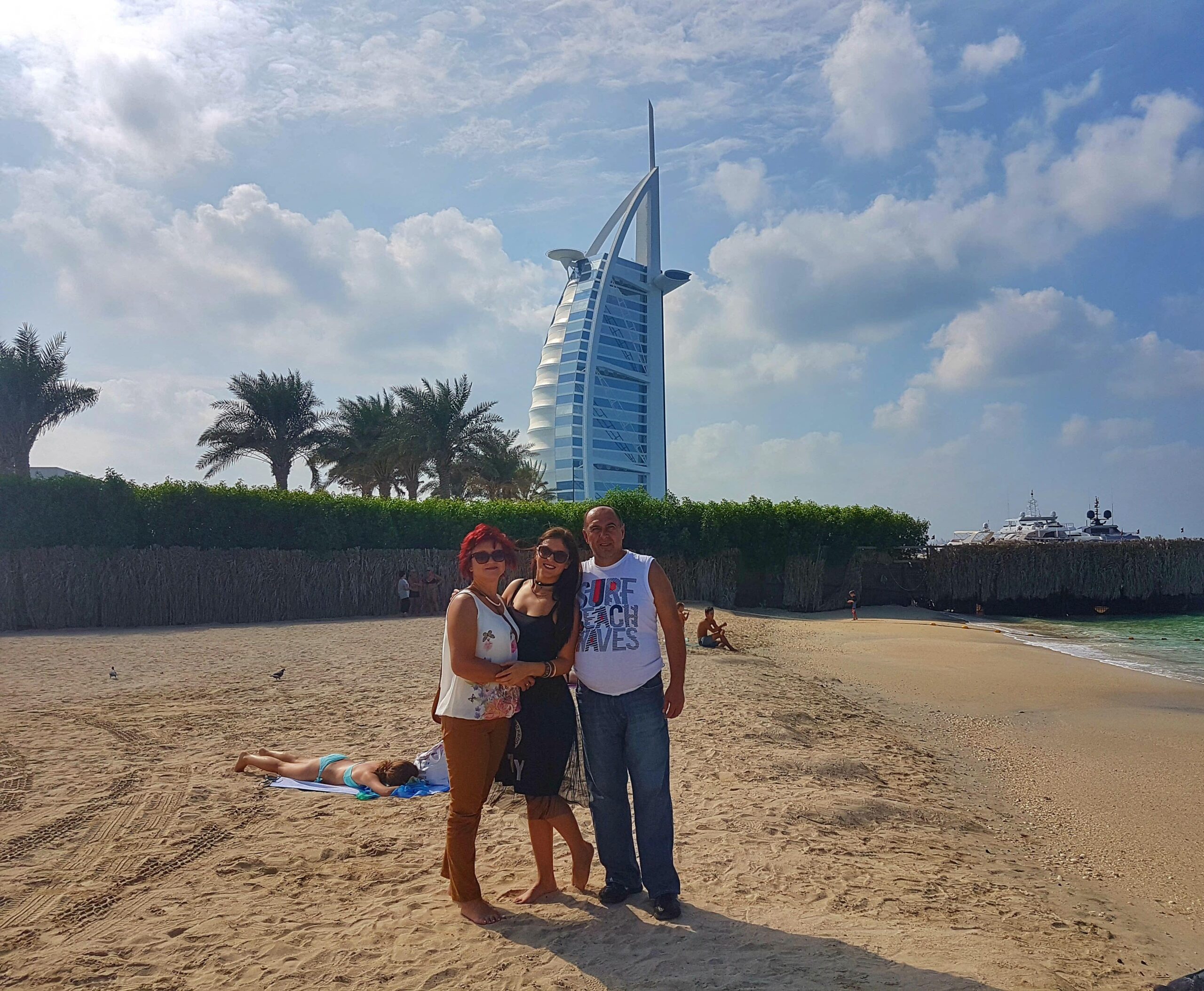 Me and my parents at the beach, overlooking Burj Al Arab hotel